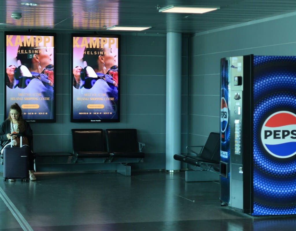 Airport Billboards vs Roadside Billboards: What Changes for Your Brand?